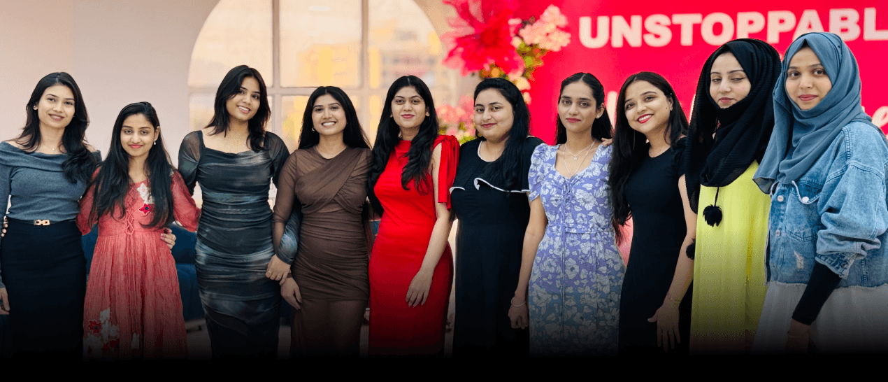 AM InfoWeb Women’s Day showing women employees celebrating together during an office event.